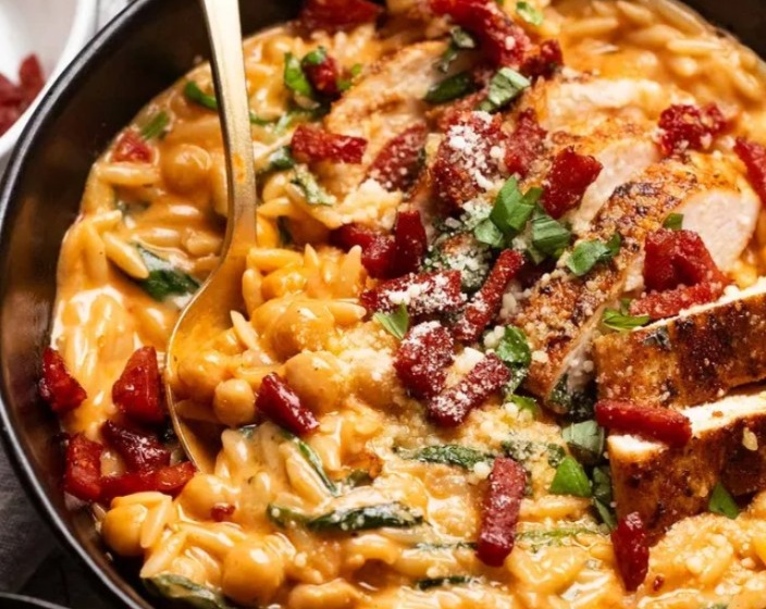 One pot chicken risoni with crispy salami top view